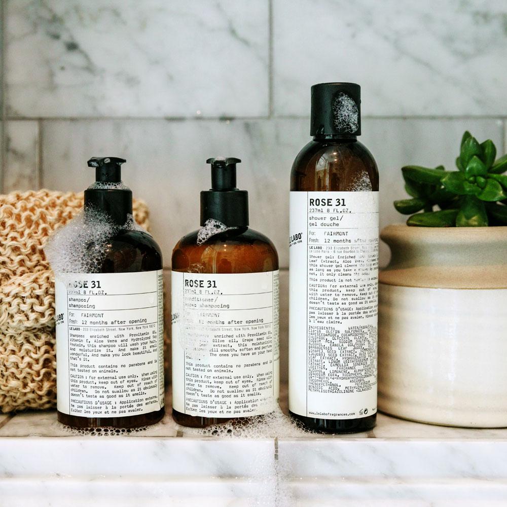Le Labo products displayed on the shower ledge