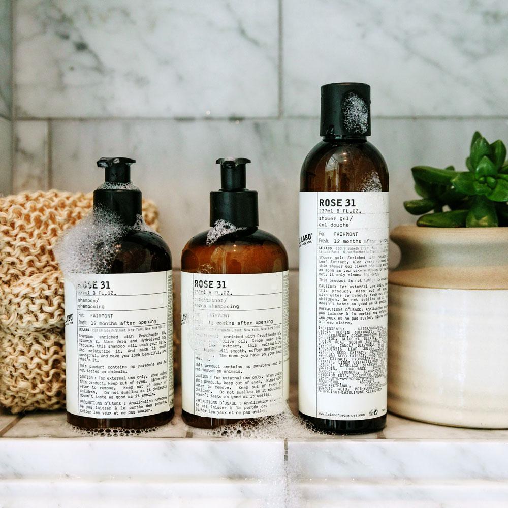 Le Labo products displayed on the shower ledge
